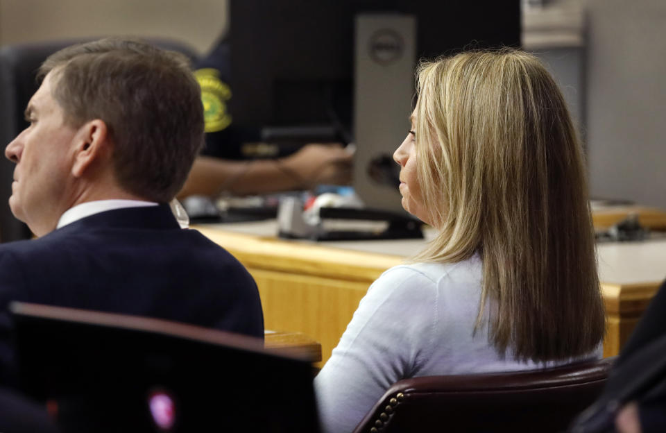 Former Dallas police Officer Amber Guyger listens to the prosecutions' closing arguments in her murder trial in the 204th District Court at the Frank Crowley Courts Building in Dallas, Monday, September 30, 2019. Guyger shot and killed Botham Jean, an unarmed 26-year-old neighbor in his own apartment last year. She told police she thought his apartment was her own and that he was an intruder. (Tom Fox/The Dallas Morning News via AP, Pool)