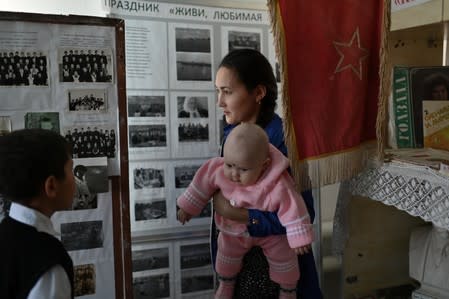 The Wider Image: Russian village's last teacher stays on for her one remaining pupil