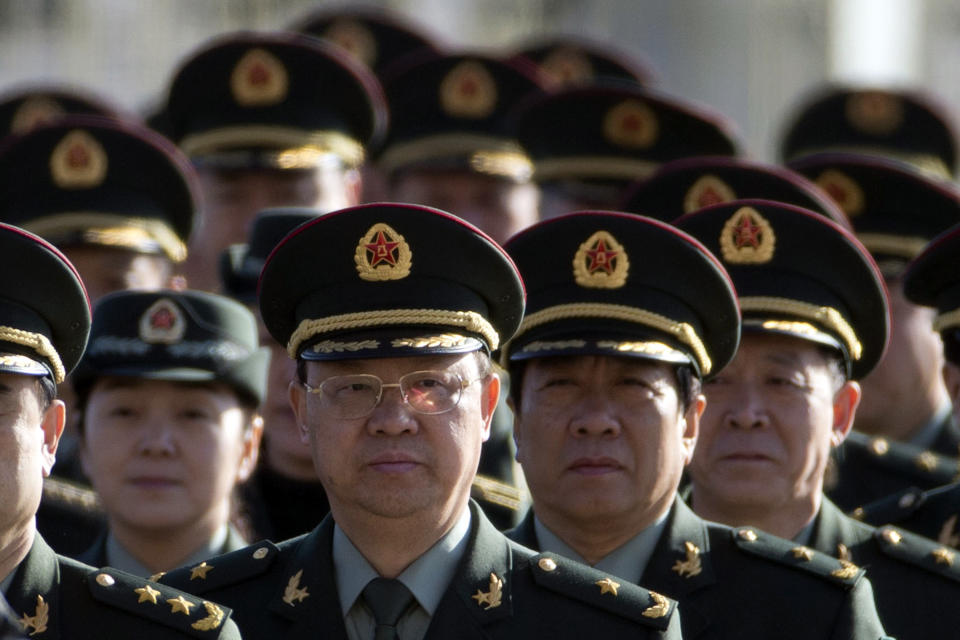 Delegates from China's People's Liberation Army (PLA) march from Tiananmen Square to the Great Hall of the People to attend sessions of National People's Congress and Chinese People's Political Consultative Conference in Beijing, China, Tuesday, March 4, 2014. (AP Photo/Ng Han Guan)