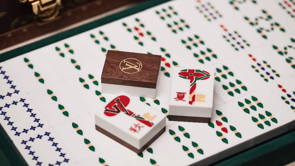 The mahjong tiles also contain hand-painted elements from the brand’s floral motifs made from walnut wood and corian. - Credit: www.PiotrStoklosa.com/Louis Vuitton