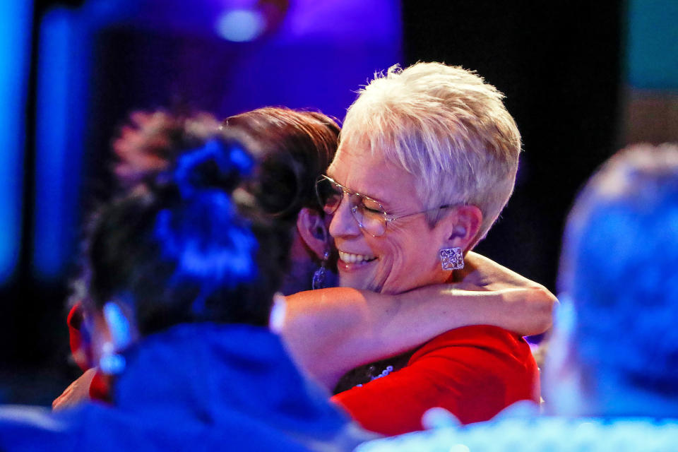 Jamie Lee Curtis hugs Michelle Yeoh before accepting the award for Female Actor in a Supporting Role the at the 29th Annual SAG Awards. (Robert Gauthier / Los Angeles Times via Getty Imag)