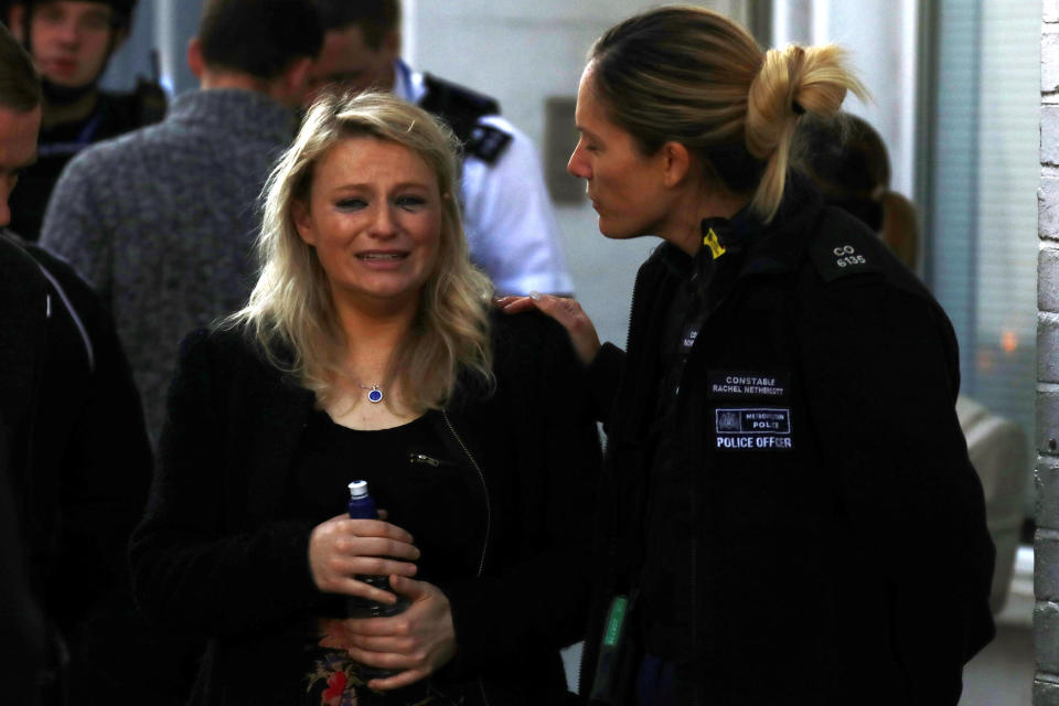 A woman comforted by police after the explosion at Parsons Green (Reuters)