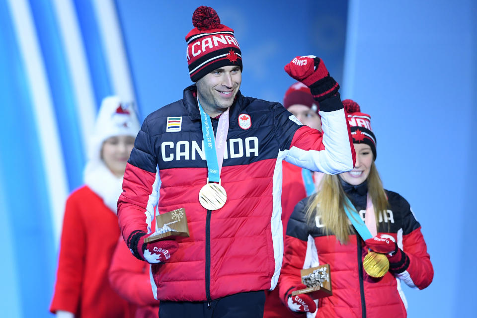 <p>Gold medalists John Morris and Kaitlyn Lawes of Canada celebrate winning the gold medal in mixed doubles curling. (Getty) </p>