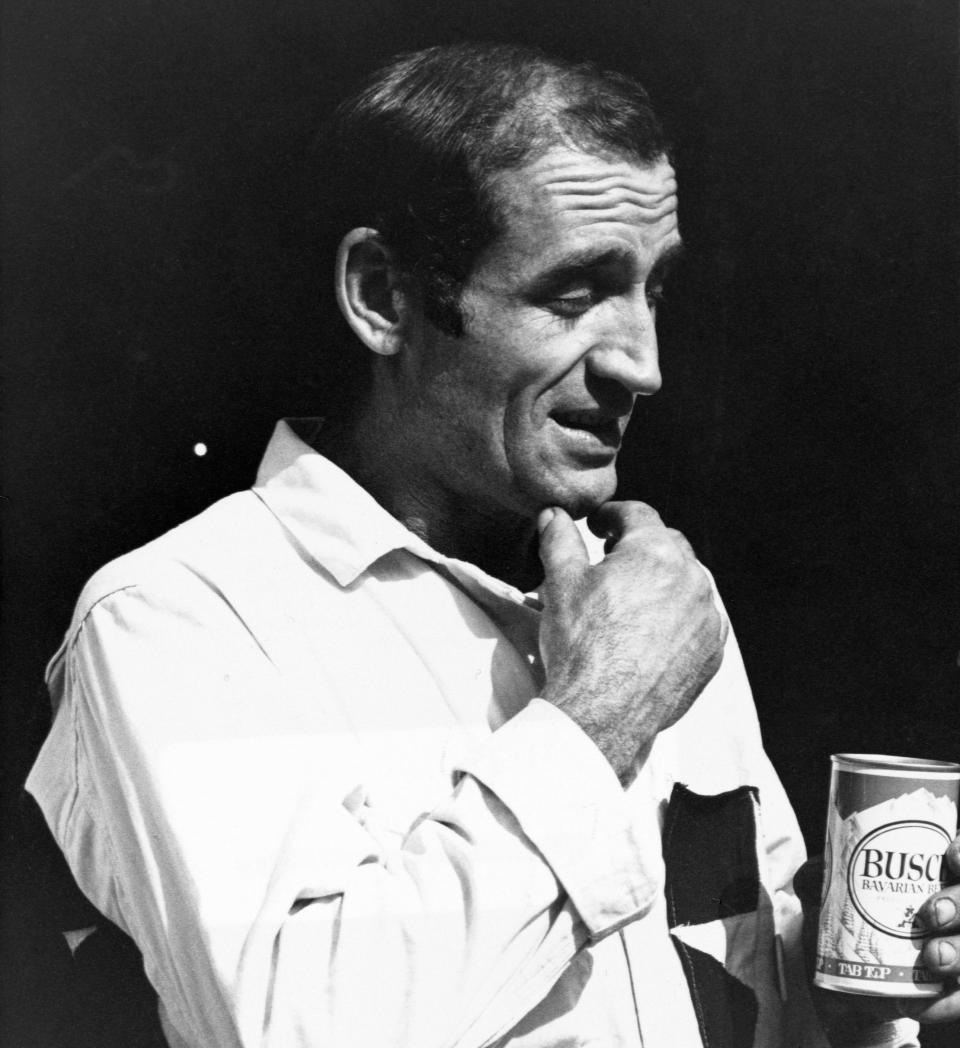 Jack Karouac, author of The Dharma Bums, holding a can of Busch beer