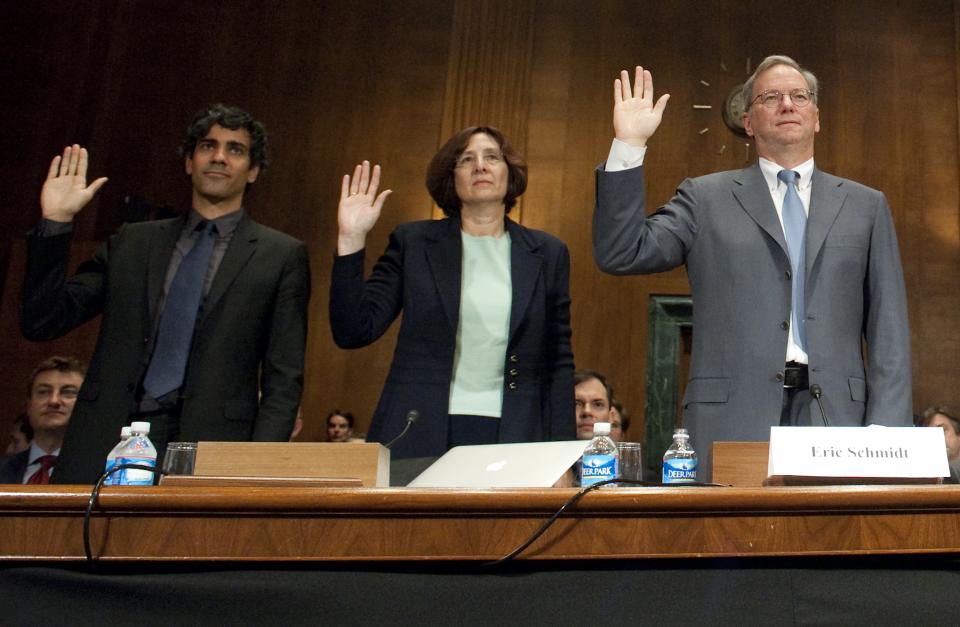 Eric Schmidt (R), Chairman of Google, Susan  Creighton (C), a partner with Wilson Sonsini Goodrich and Rosati, and Jeremy Stoppelman (L), co-founder and CEO of Yelp, are sworn in prior to testifying before the US Senate Judiciary Committee's Subcommittee on Antitrust, Competition Policy and Consumer Rights, during a hearing on Google's business and privacy practices on Capitol Hill in Washington, DC, September 21, 2011. Schmidt defended the Internet giant on Wednesday against accusations it is abusing its dominant position in online search. In written testimony submitted to a US Senate antitrust subcommittee hearing, Schmidt said most complaints about Google "come from websites that don't like where their sites rank on Google's search results page." AFP PHOTO / Saul LOEB (Photo credit should read SAUL LOEB/AFP via Getty Images)