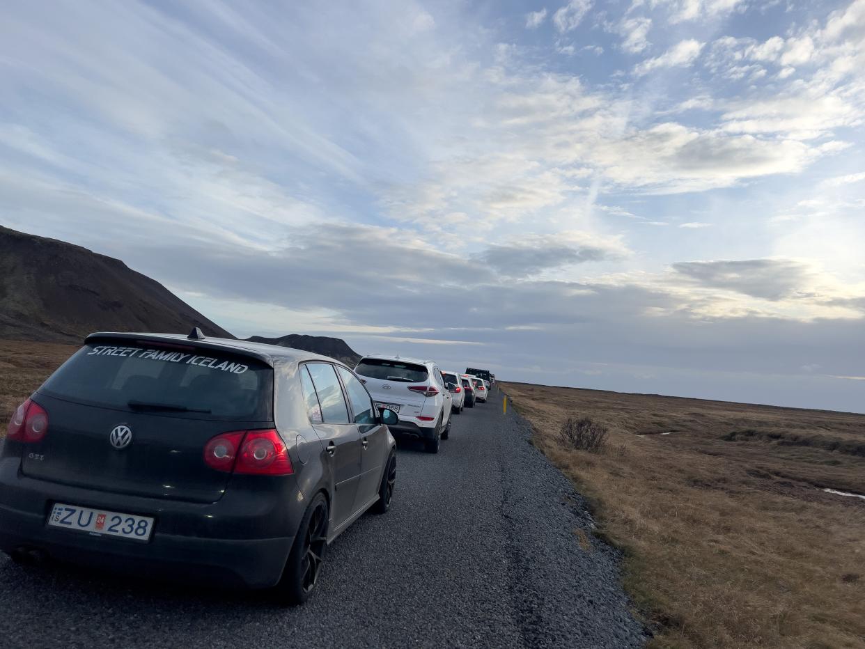 Residents wait in a long line of cars to get into Grindavik to collect personal items on November 14, 2023 in Grindavik, Iceland. For the second day residents were allowed in to quickly collect personal belongings. (Getty Images)