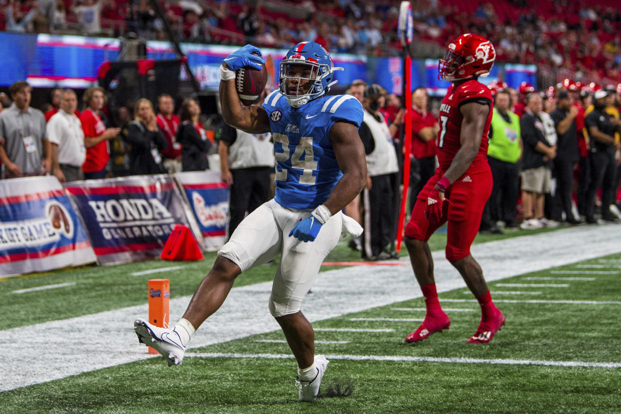 Mississippi running back Snoop Conner (24) scores a touchdown during the second half of an NCAA football game against Louisville on Monday, Sept. 6, 2021, in Atlanta. (AP Photo/Danny Karnik)