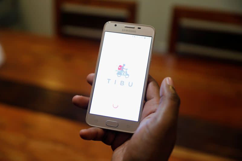 A man displays the TIBU Health app of the Nairobi-based startup on his phone in Nairobi