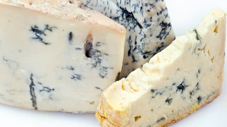 Sliced blue-veined gorgonzola cheese