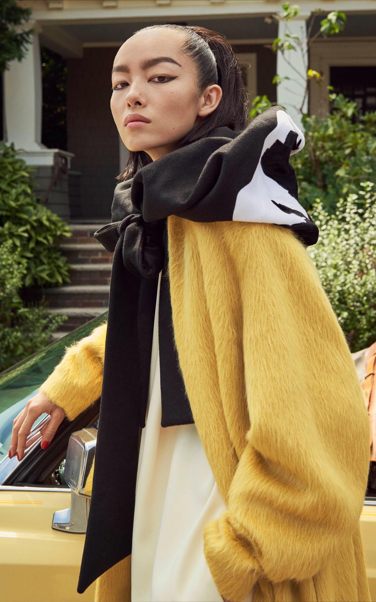 Fei Fei Sun wears wool coat, £2,490, silk jumpsuit, £4,500, and wool hood, £3,690, all Valentino - Pamela HANSON.  Styling by Paul CAVACO