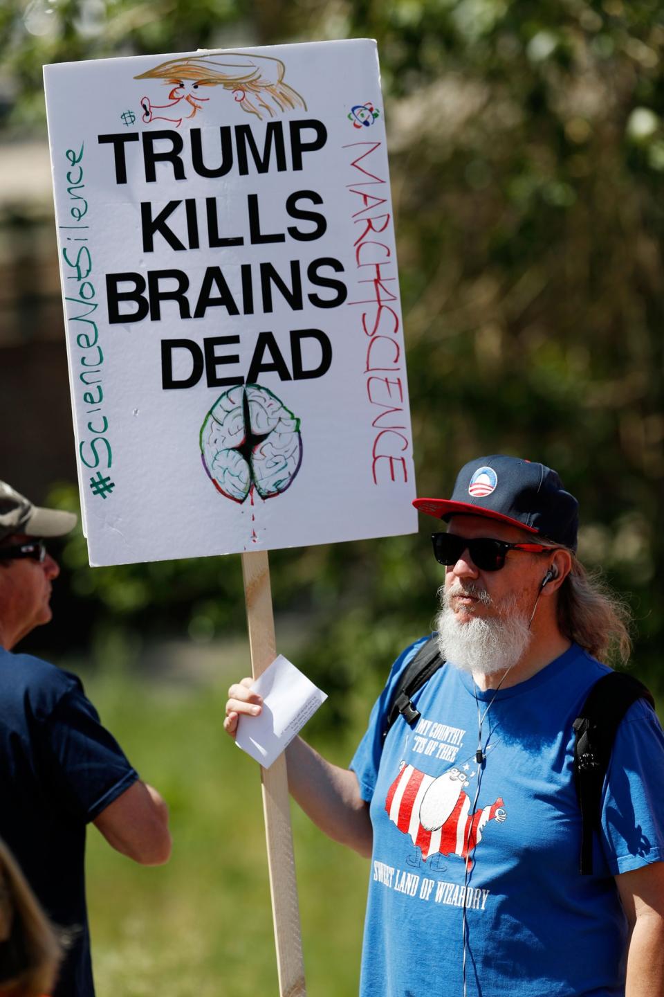 <p>Chris Pitchfork of Denver holds up a placard during a protest against the polices of President Donald Trump Saturday, June 3, 2017, in downtown Denver, Colo. (Photo: David Zalubowski/AP) </p>