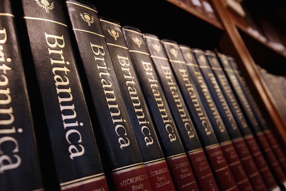 Several volumes of Encyclopedia Britannica on a shelf