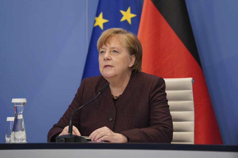 German Chancellor Angela Merkel speaks at the Chancellery in Berlin, Germany, Tuesday, Jan. 26, 2021 during an online conference at the Davos Agenda. The Davos Agenda from Jan. 25 to Jan. 29, 2021 is an online edition due to the coronavirus disease (COVID-19) outbreak. The global effort in the fight against the coronavirus pandemic is among the major topics facing the Davos forum this year. (Sean Gallup/Pool Photo via AP)