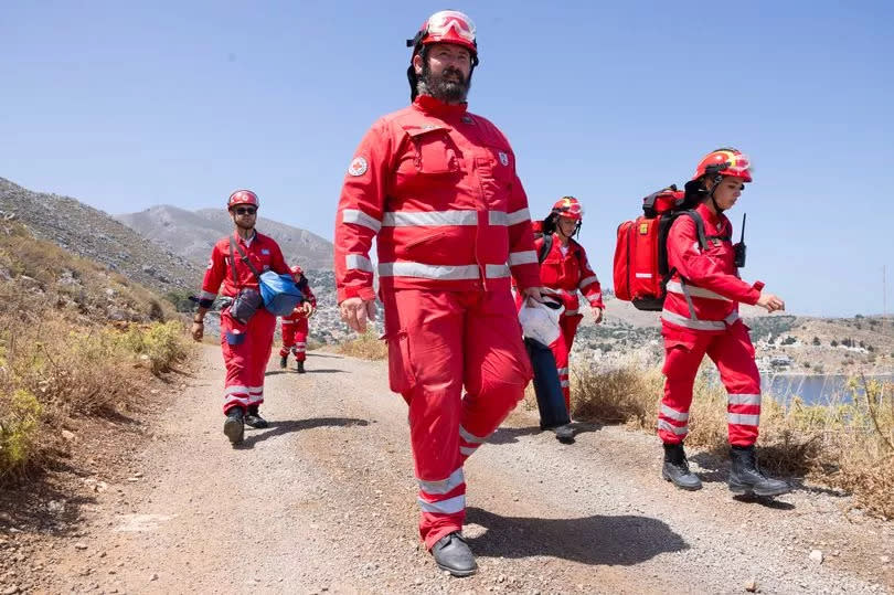 Greek Red Cross team search the hills between the towns of Symi and Pedi for missing Dr Michael Mosley