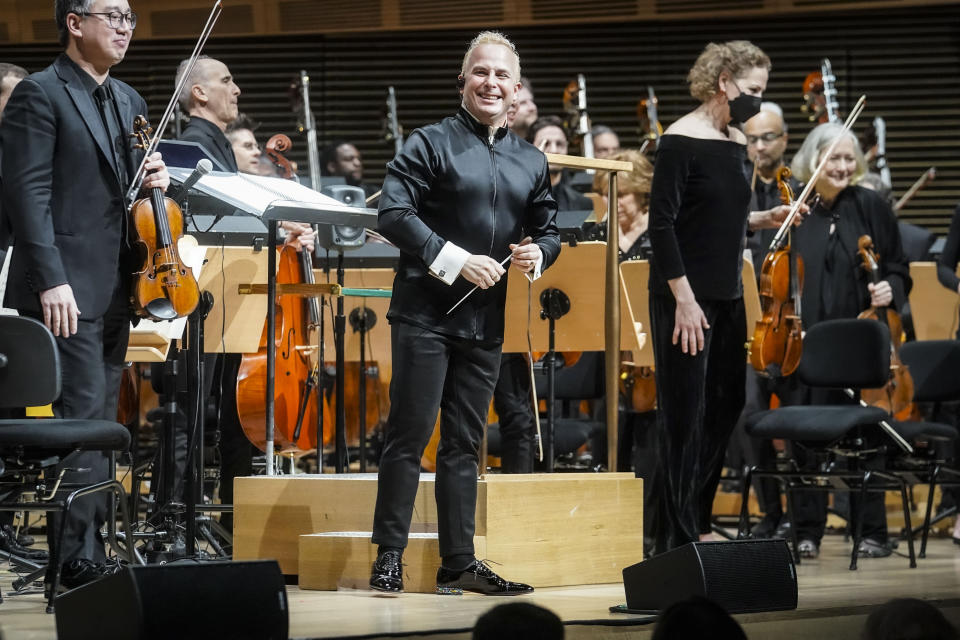 Metropolitan Opera's new music director Yannick Nézet-Séguin, center, acknowledge applause before his debut as conductor for the New York Philharmonic, Wednesday, Feb. 14, 2024, in New York. (AP Photo/Bebeto Matthews)