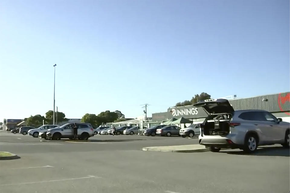 This image from a video, shows a parking lot where an incident occurred in Perth, Australia Sunday, May 5, 2024. A 16-year-old boy armed with a knife was shot dead by police after he stabbed a man in the Australian west coast city of Perth, officials said Sunday. (Australian Broadcasting Corporation via AP)