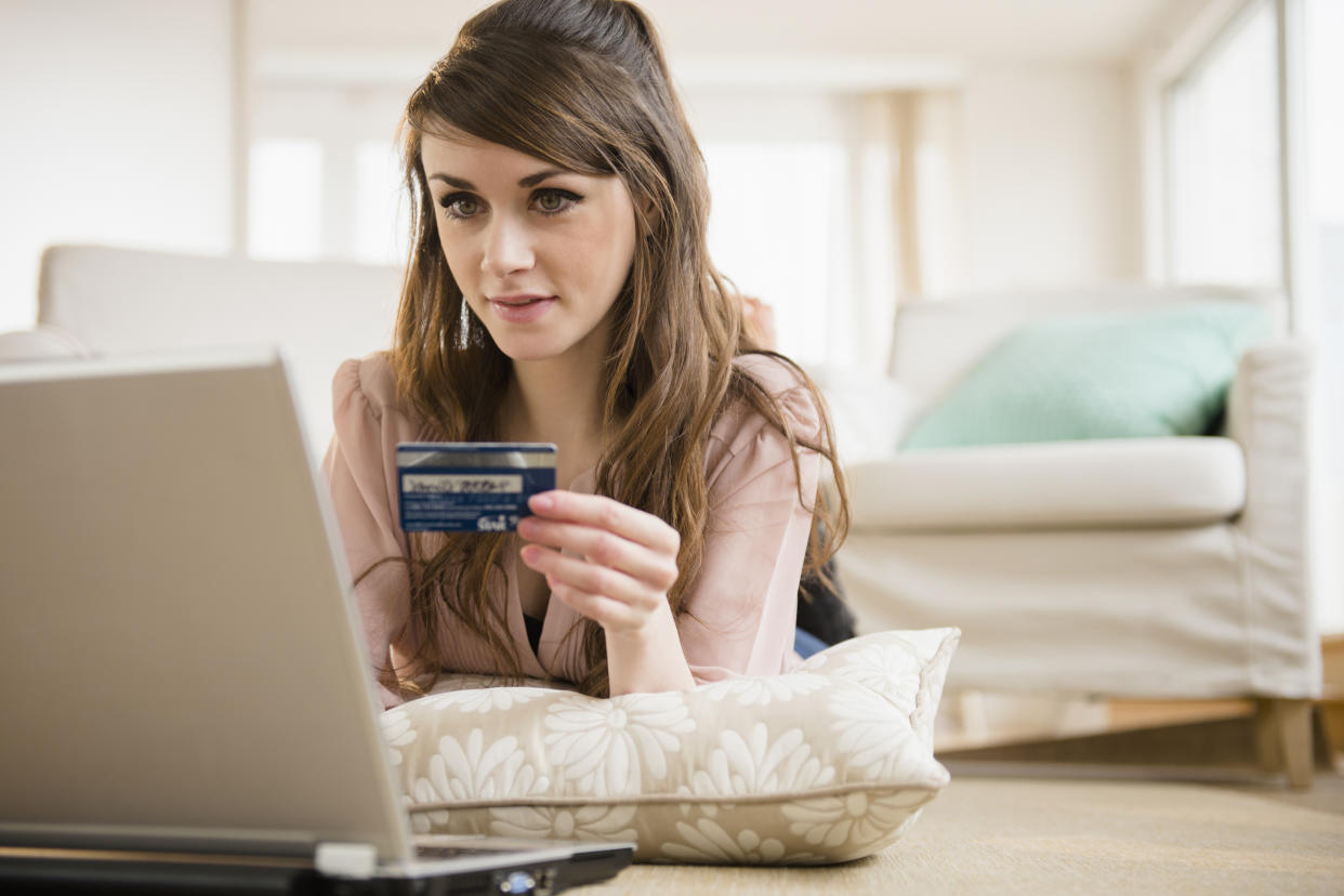 USA, New Jersey, Jersey City, Young woman shopping online with credit card