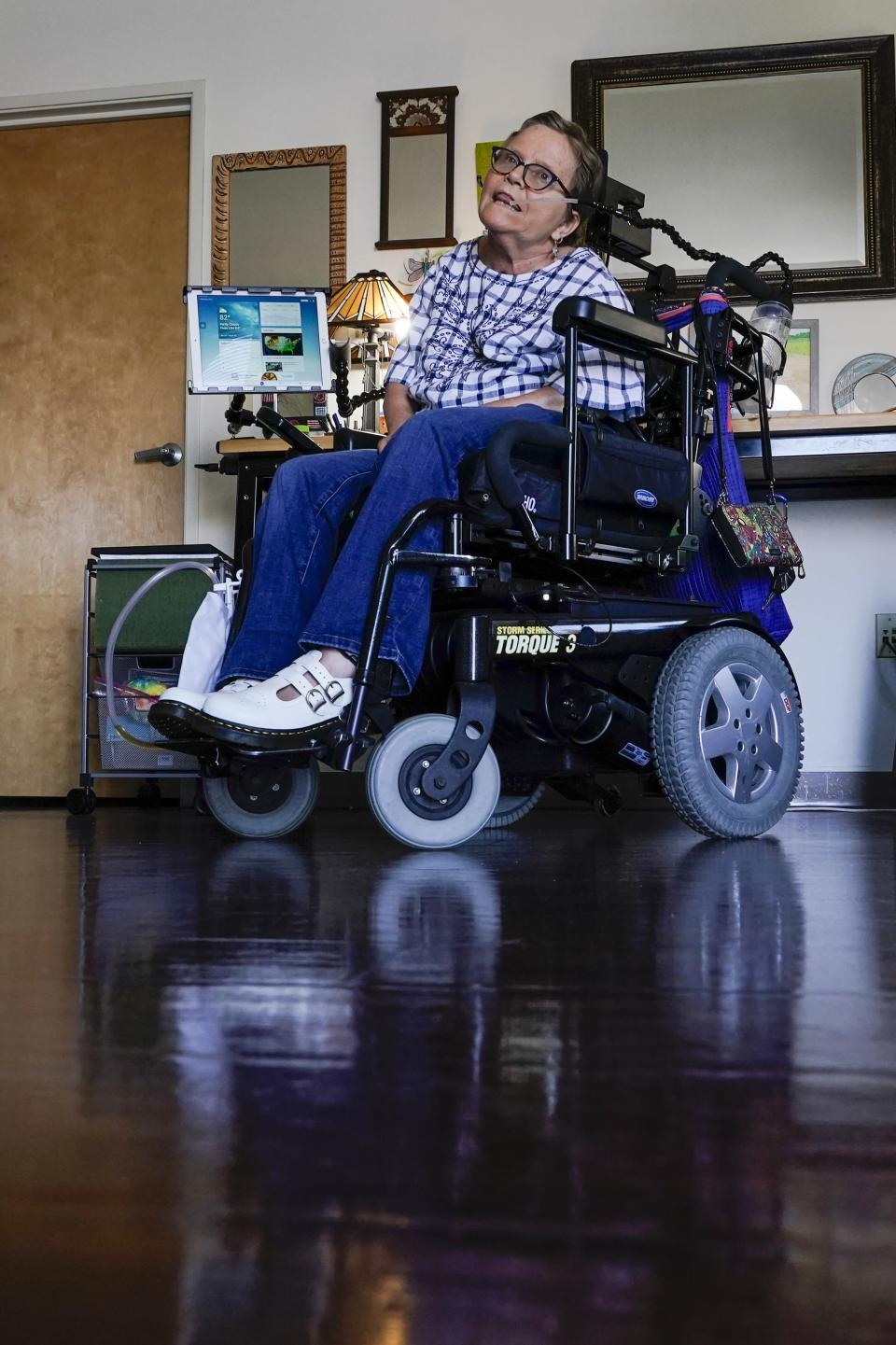 Martha Chambers pose in her apartment Friday, Sept. 2, 2022, in Milwaukee. Wisconsin voters with disabilities are celebrating a win after a federal judge, citing the Voting Rights Act, ruled that they may get assistance returning their ballots. (AP Photo/Morry Gash)
