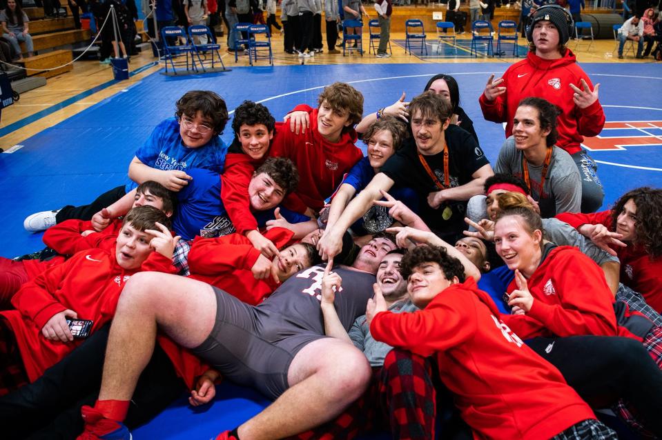 Red Hook wrestlers celebrate after winning the Section 9 Division 2 team title on Sunday at SUNY Ulster.