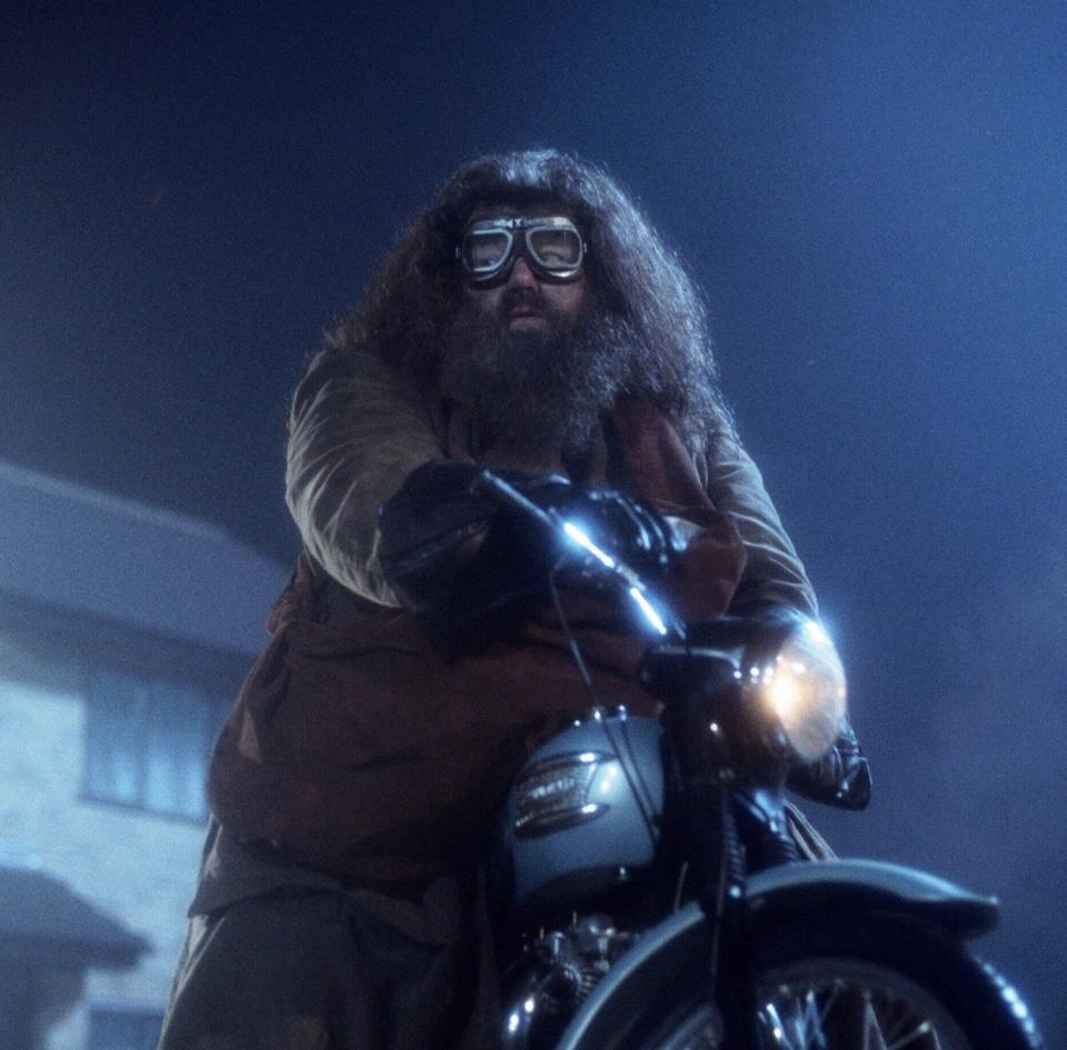 Hagrid on a big motorbike that's as giant as he is