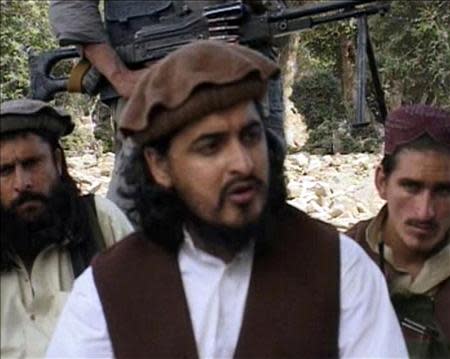 Pakistani Taliban chief Hakimullah Mehsud (C) sits with other militants in South Waziristan, in this file still image taken from video shot October 4, 2009 and released October 5, 2009. REUTERS/Reuters TV/Files