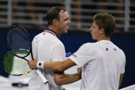 Sam Querrey, left, of the United States, and lya Ivashka meet after their match during the first round of the US Open tennis championships, Tuesday, Aug. 30, 2022, in New York. (AP Photo/Charles Krupa)