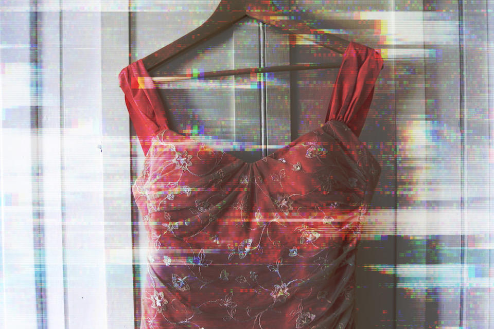 A dress hanging on a door