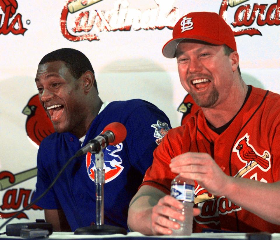 Home run sluggers Sammy Sosa of the Chicago Cubs, left, and St. Louis Cardinals' Mark McGwire laugh together during a news conference in St. Louis, Monday morning,  Sept. 7, 1998. Both men are chasing Roger Maris' major league record of 61 home runs in a season. Heading into Monday's game between the Cubs and Cardinals, McGwire has 60 home runs and Sosa has 58. (AP Photo/Eric Draper)