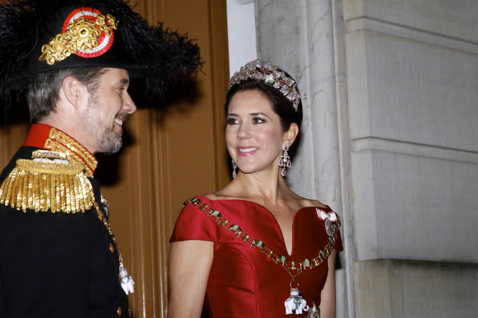 The mum-of-four looked at her dashing husband, Prince Frederik, as they entered the party. Photo: Australscope