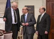 FILE - In this Dec. 16, 2013, file photo Federal Reserve Board Chairman Ben Bernanke, right, with former chairmen Paul Volcker, left, and Alan Greenspan, talk after participating in the ceremonial signing of a certificate commemorating the 100th anniversary of the signing of the Federal Reserve Act at the Federal Reserve Building in Washington. Volcker, the former Federal Reserve chairman died on Sunday, Dec. 8, 2019, according to his office, He was 92. (AP Photo/Pablo Martinez Monsivais, File)