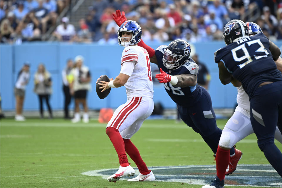 Tennessee Titans defensive tackle Jeffery Simmons (98) forces New York Giants quarterback Daniel Jones (8) to fumble during the first half of an NFL football game Sunday, Sept. 11, 2022, in Nashville. (AP Photo/Mark Zaleski)