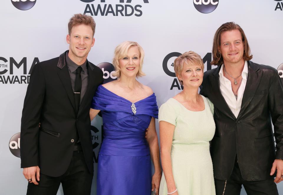 Brian Kelley (L) and Tyler Hubbard (R) of Florida Georgia Line and their guests arrive at the 47th Country Music Association Awards in Nashville, Tennessee November 6, 2013. REUTERS/Eric Henderson (UNITED STATES - Tags: ENTERTAINMENT)