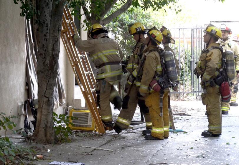 Firefighters at scene of explosion at apartment building in Van Nuys on Saturday, March 16, 2024.