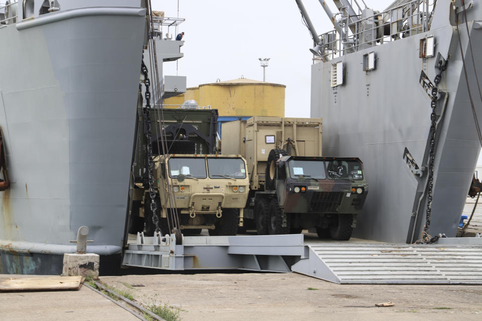 U.S. army vehicles disembark from a vessel at Albania's main port of Durres, Saturday, May 1, 2021. Florida National Guard's 53rd Infantry Brigade Combat Team were being discharged from the USNS Bob Hope ahead of a two-week training of up to 6,000 U.S. troops in six Albanian military bases, as part of the Defender-Europe 21 large-scale U.S. Army-led exercise. (AP Photo/Hektor Pustina)