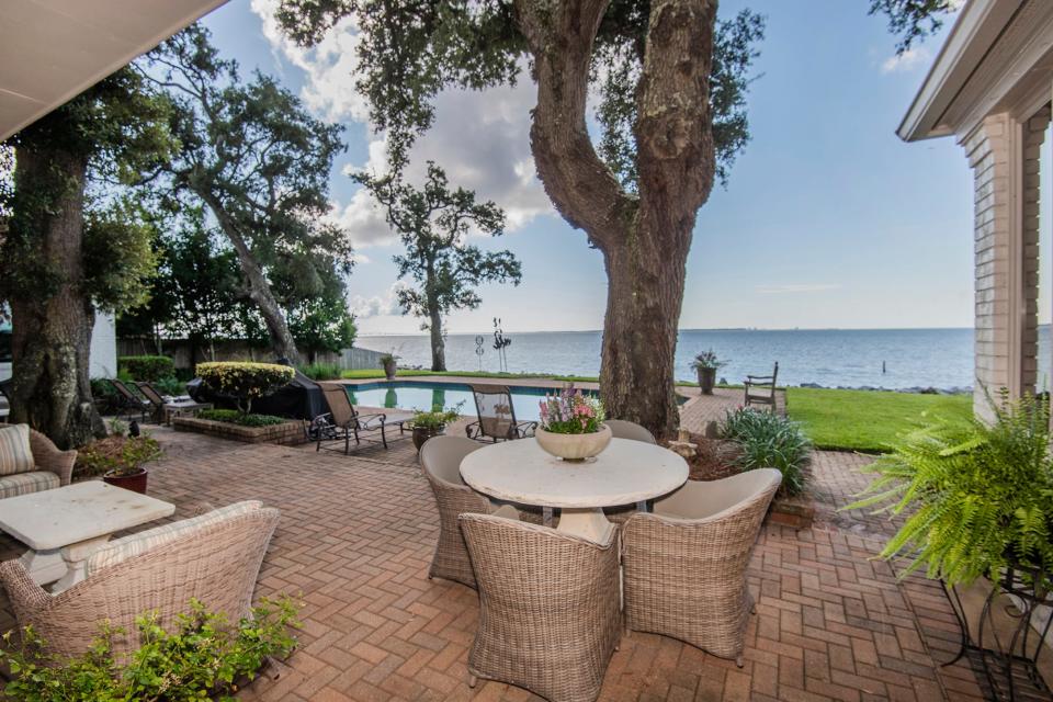 Kick back with friends and family on the patio and enjoy the pool, and a bay view.