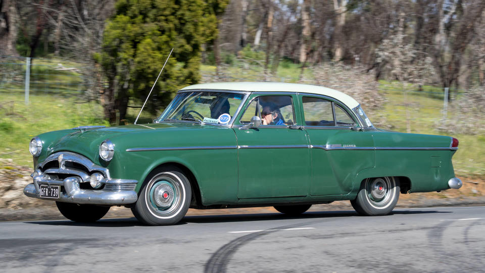 Adelaide, Australia - September 25, 2016: Vintage 1954 Packard Clipper Sedan driving on country roads near the town of Birdwood, South Australia.