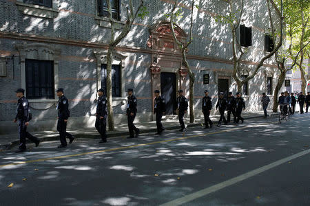 Policemen walk along a blocked road near the Museum of the First National Congress of the Chinese Communist Party, as China's President Xi Jinping visits the museum, in Shanghai, China, October 31, 2017. REUTERS/Aly Song