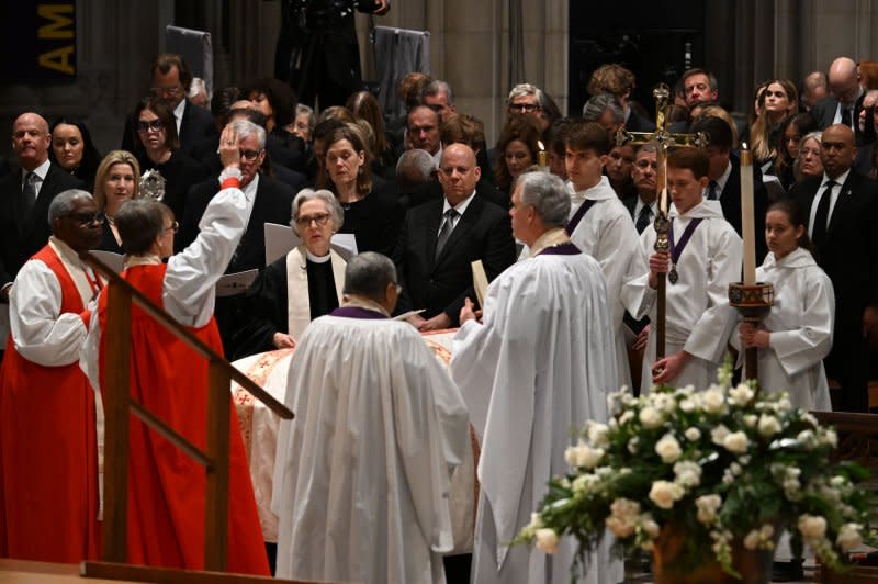 Celebrants pray over the casket of former Supreme Court Justice Sandra Day O'Connor during her funeral service at the National Cathedral in Washington, D.C., on Tuesday. Pool Photo by Jim Watson/UPI