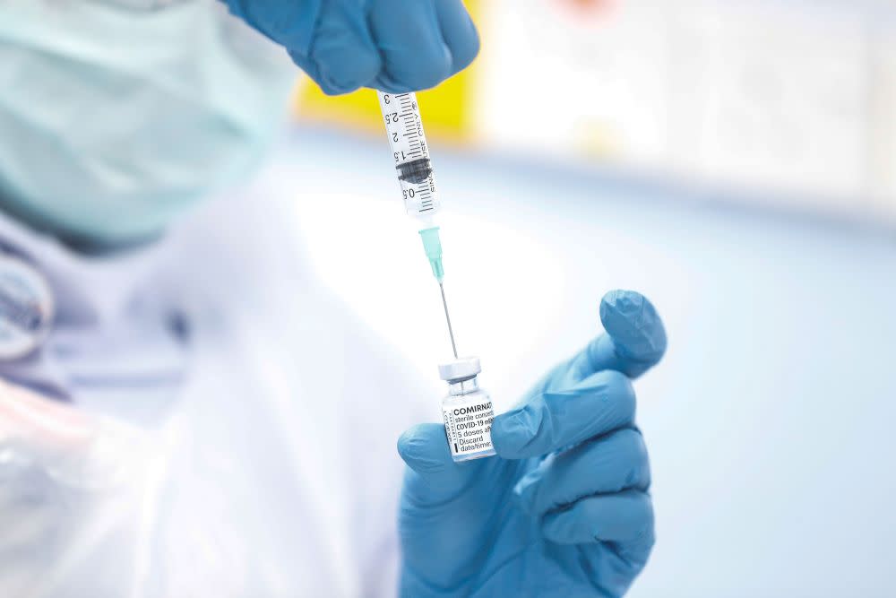 A nurse loads a syringe with a dose of the Pfizer-BioTech Covid-19 vaccine at the Penang General Hospital in George Town March 2, 2021. — Picture by Sayuti Zainudin