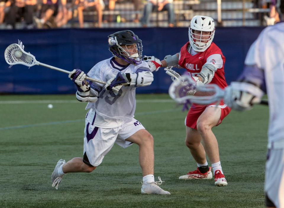 Rumson's Cole Cashion (19) pulls back and shoots. Rumson-Fair Haven Boys Lacrosse defeats  Wall 12-7 in Shore Conference Tournament Final in West Long Branch, NJ on May 17, 2022.