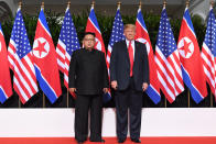 <p>President Donald Trump (R) poses with North Korea’s leader Kim Jong Un (L) at the start of their historic US-North Korea summit, at the Capella Hotel on Sentosa island in Singapore on June 12, 2018. (Photo: Saul Loeb/AFP/Getty Images) </p>
