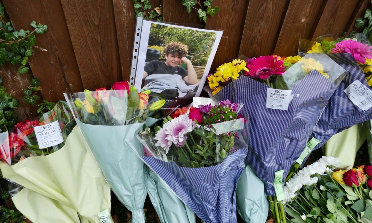 <span>Floral tributes to 13-year-old Oliver Stephens, who was murdered after a dispute on social media.</span><span>Photograph: Geoff Swaine/REX/Shutterstock</span>