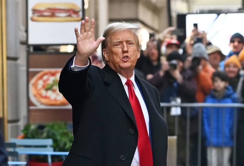 Former US president Donald Trump steps out of 40 Wall Street following his press conference after a pre-trial hearing at Manhattan criminal court.  A criminal trial against former US president Donald Trump in New York over alleged 2016 hush money payments to former porn star Stormy Daniels will begin on April 15, three weeks later than originally planned, according to US media reports. Andrea Renault/ZUMA Press Wire/dpa