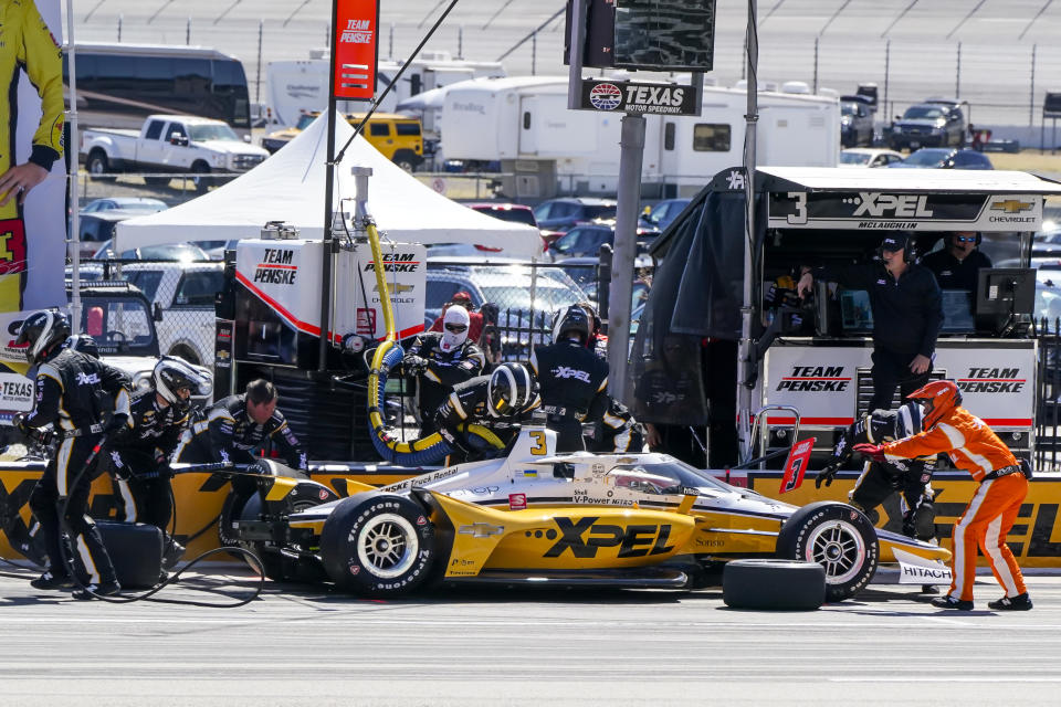 Scott McLaughlin makes a pit stop during the NTT IndyCar Series XPEL 375 at Texas Motor Speedway in Fort Worth, Texas, on Sunday, March 20, 2022. (AP Photo/Larry Papke)