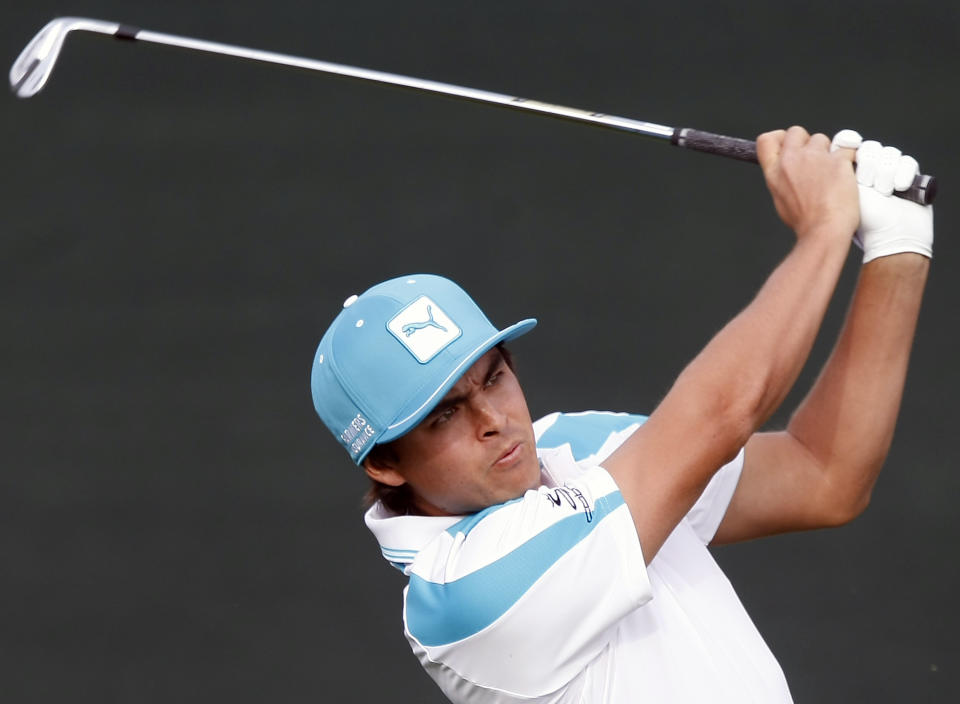 Rickie Fowler tees off on the 16th hole during the first round of the Waste Management Phoenix Open golf tournament on Thursday, Jan. 30, 2014, in Scottsdale, Ariz. (AP Photo/Rick Scuteri)