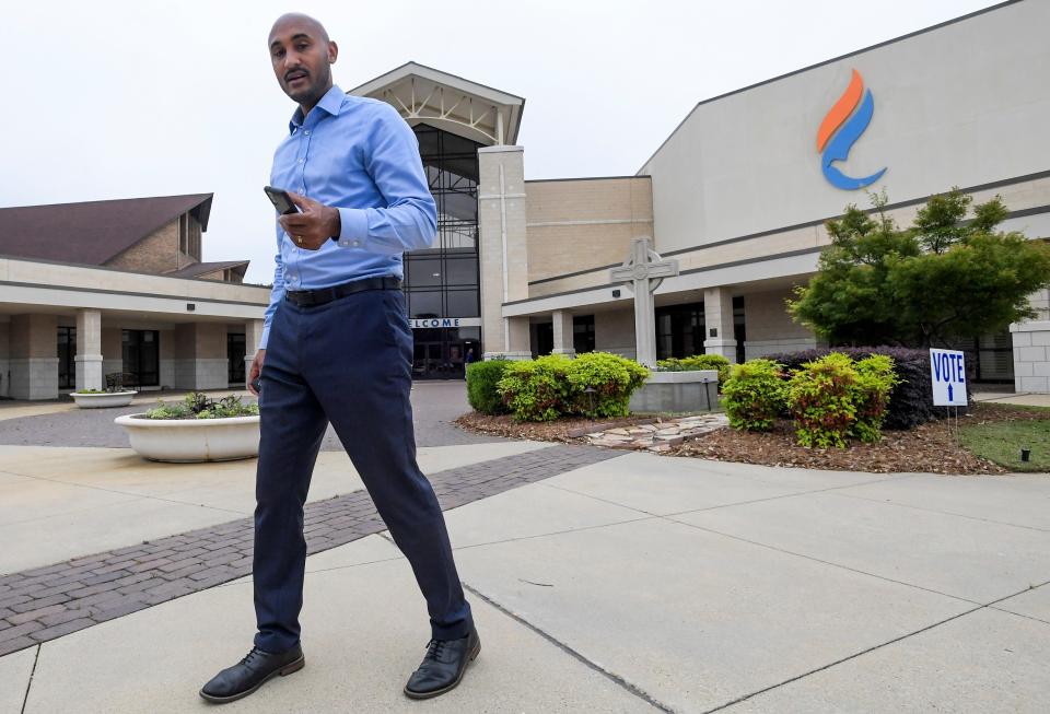 Shomari Figures talks with voters outside of the Frazer Church polling place during the runoff election in Montgomery, Al., on Tuesday April 16, 2024.