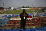 A Pakistani police officer stands guard an enclosure of the Pindi Cricket Stadium before the stat of the first one day international cricket match between Pakistan and New Zealand at the Pindi Cricket Stadium, in Rawalpindi, Pakistan, Friday, Sept. 17, 2021. The limited-overs series between Pakistan and New Zealand has been postponed due to security concerns of the Kiwis. (AP Photo/Anjum Naveed)