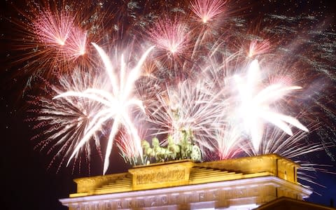 Fireworks explode next to the Quadriga sculpture - Credit: HANNIBAL HANSCHKE/REUTERS