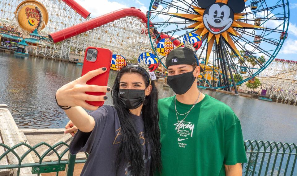 Dixie D'Amelio and Noah Beck take a selfie together at Disneyland.