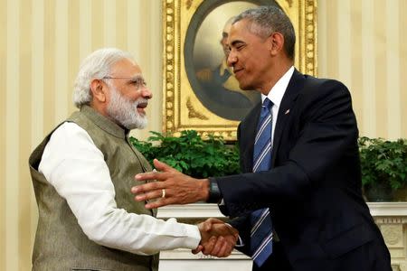 U.S. President Barack Obama (R) shakes hands with India's Prime Minister Narendra Modi after their remarks to reporters following a meeting in the Oval Office at the White House in Washington, U.S. June 7, 2016. REUTERS/Jonathan Ernst/File Photo